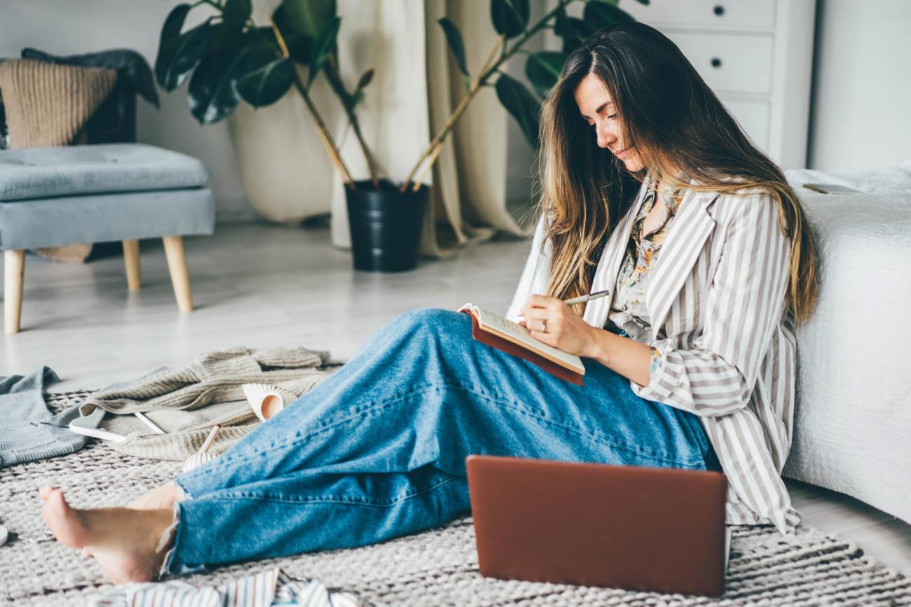 woman sitting and writing